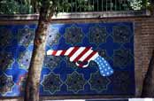 Political propaganda at walls of old US emabassy. Tehran. Iran.
