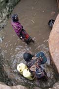 The water is retrieving from 10m deep well by men-chain to small reservoir. Men are singing for better synchronization. Singing well, Dublock. South, Ethiopia.