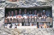 Tau tau figures in front of graves at Lemo. Tana Toraja area. Sulawesi, Indonesia.