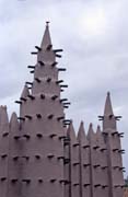 Prayer towers of muddy mosque built at sahel architecture style. Small village near Mopti. Mali.