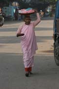Monks are going through the village each morning. They are gathering the rice for the whole day. Nyaung U. Myanmar (Burma).