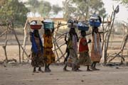 Are they on the way back from market or dishes washing? Lake Chad area. Cameroon.