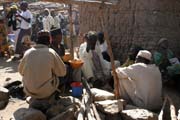 At the market at Rhumsiki (Roumsiki) village at Mandara Mountains. Drinking of local alcohol is very popular during market. Cameroon.