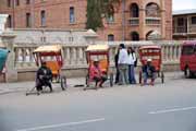 Pousse-pousses are waiting for customers. Antsirabe. Madagascar.