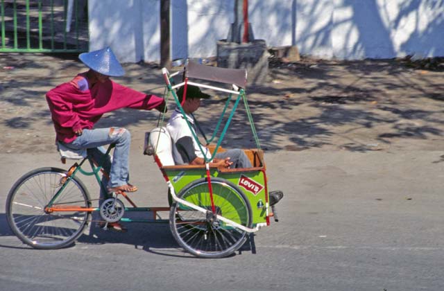 Becak - typical indonesian way of local transport. Ujung Pandang. Sulawesi,  Indonesia.