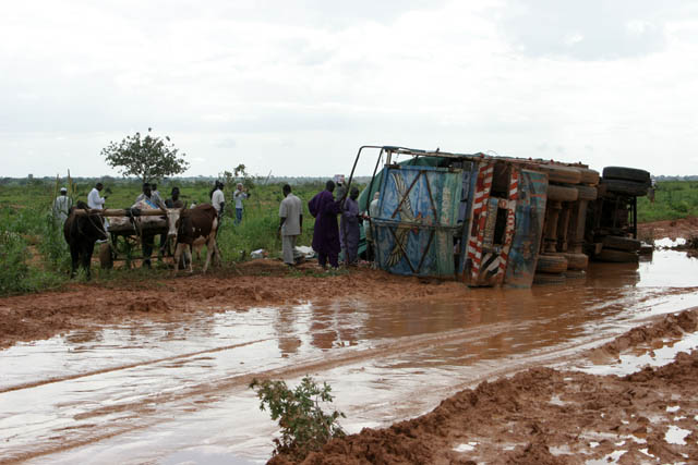 Traffic accidents are relatively common. Small unsealed part of roud from Niamey to Agadez is blocked by crashed truck. Niger.