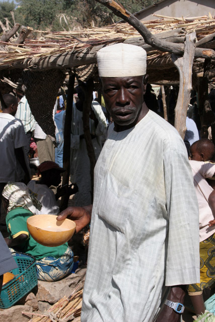 At the market at Rhumsiki (Roumsiki) village at Mandara Mountains. Drinking of local alcohol is very popular during market. Cameroon.