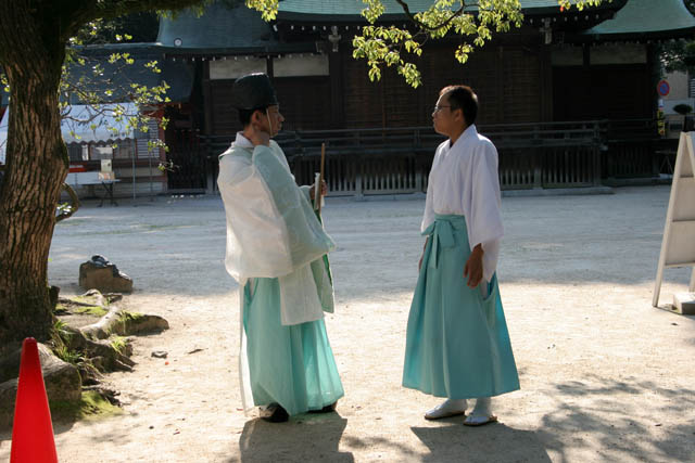 Priests near shrine at Fukuoka. Japan.