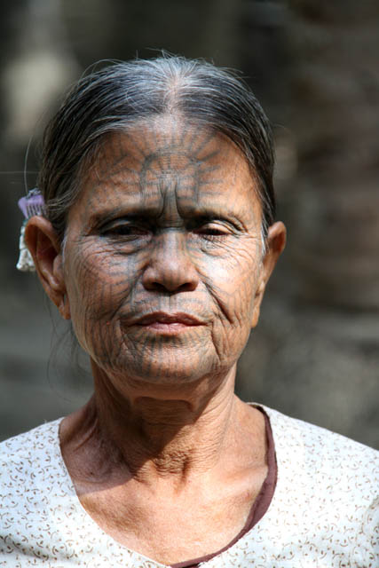 Woman from Chin tribe, Mrauk U area. Women have tradtionaly tattooed their faces. Myanmar (Burma).