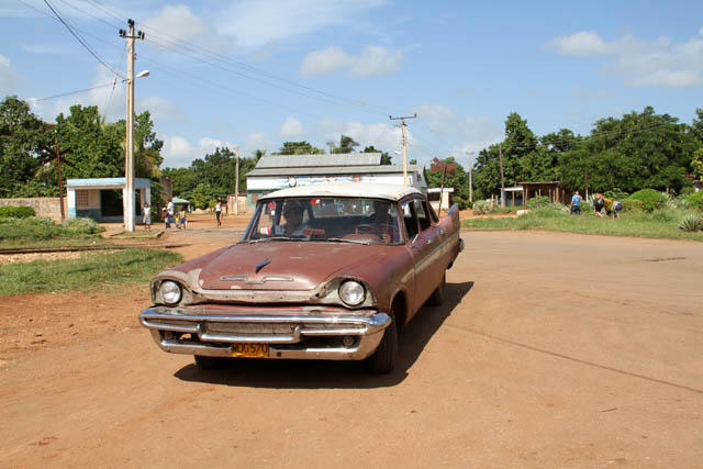 Old american cars are everywhere, Isabel village. Cuba.